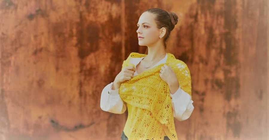 Woman wearing a yellow shawl