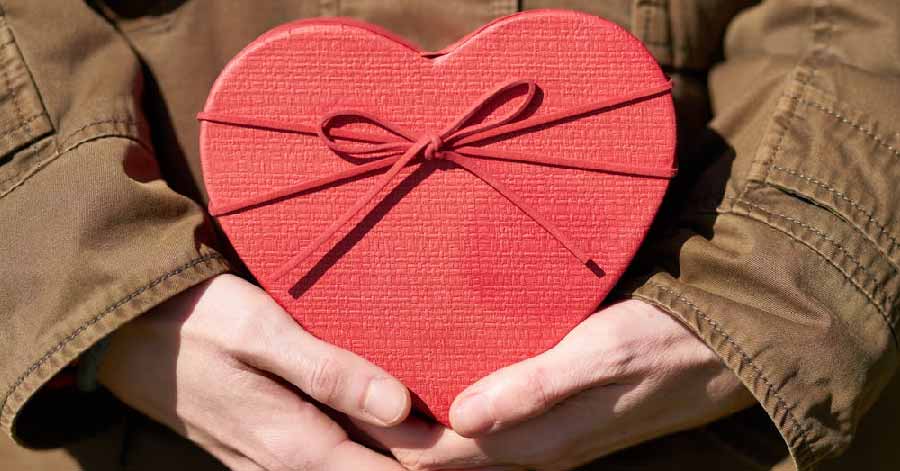  woman holding a heart-shaped box